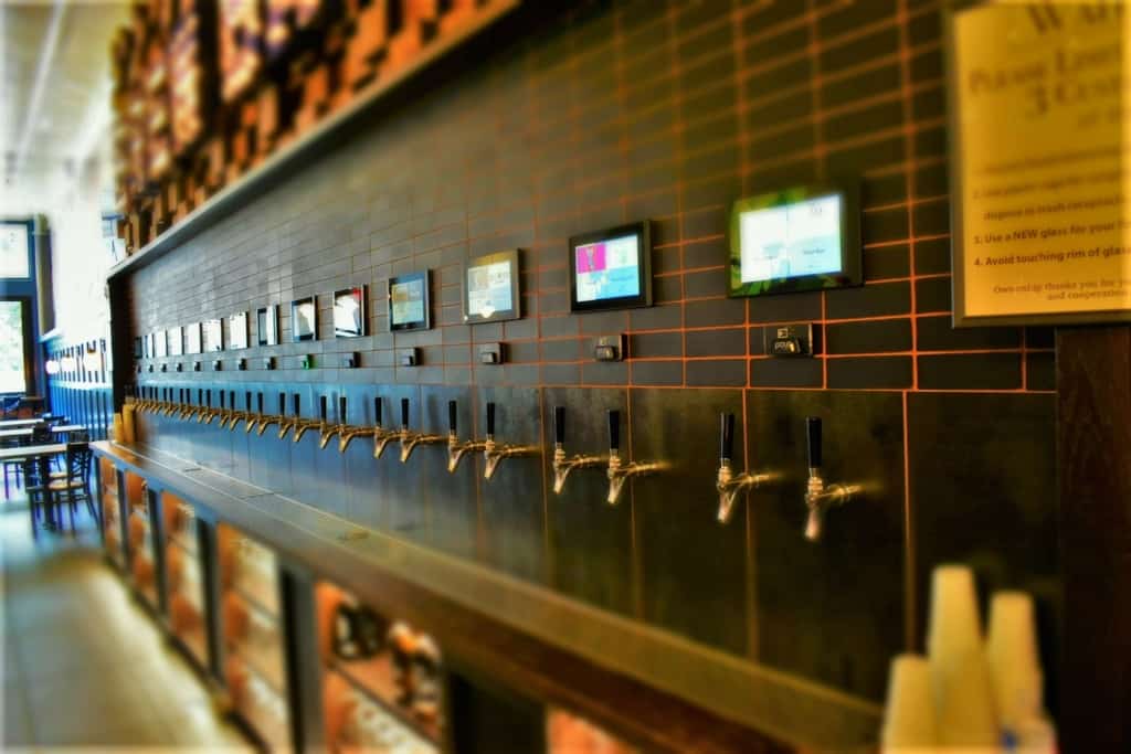 A row of taps allows customers to sample the beers by doing some self-serve banking. 