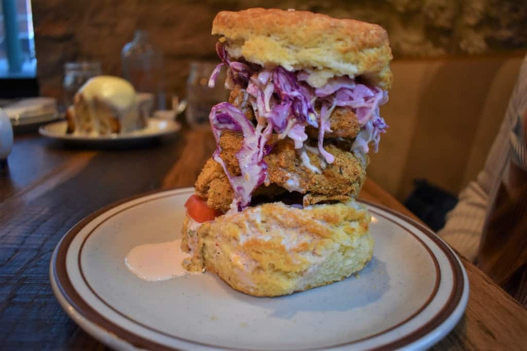 The Schooner is a towering feast of fried fish and folded biscuit. 