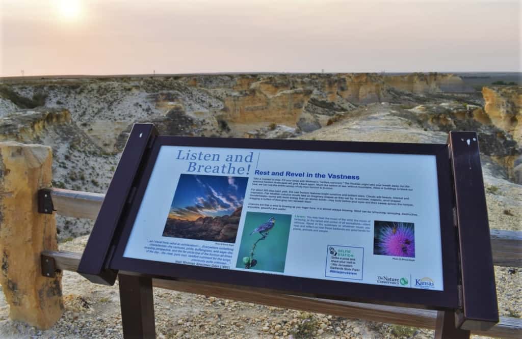 This sign reminds visitors to pause and take in the whole experience of the Kansas Badlands. 