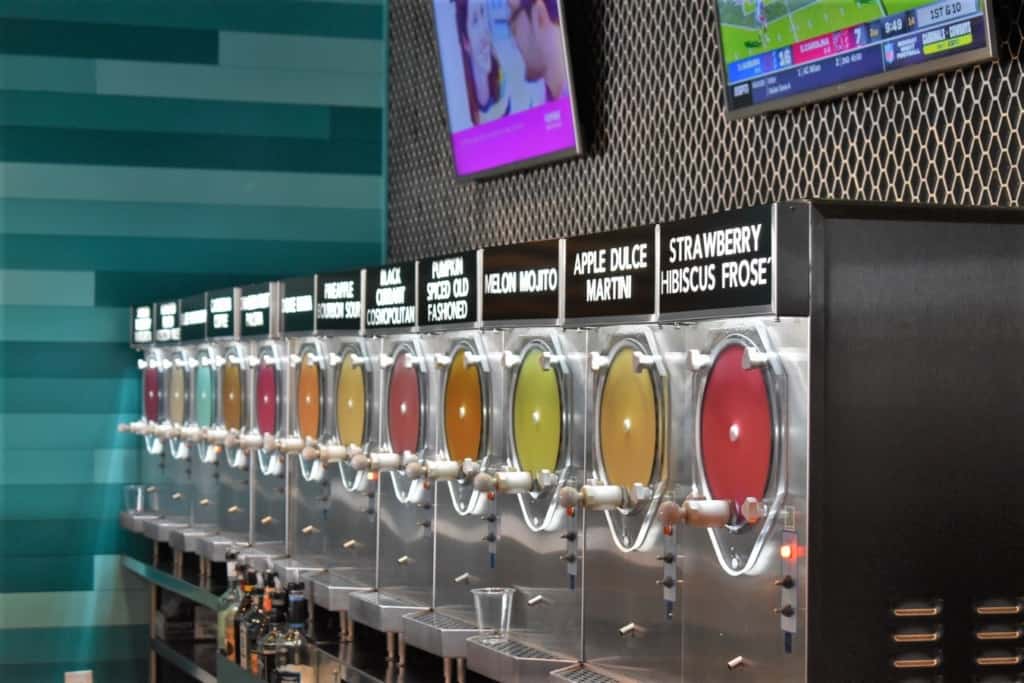 A row of slushy dispensers offers promise of tasty treasures packed with fantastic flavors. 