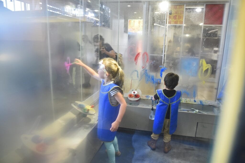Kids enjoy painting glass canvases, which can be easily cleaned and ready for more painting.