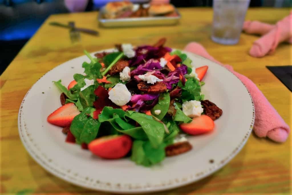 One of their fresh salads is delivered with artistic cuisine in mind. 