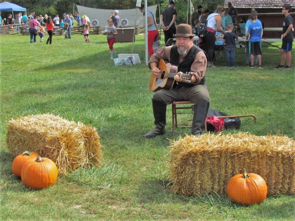 A musician entertains the crowd during the Fall Festival at Missouri Town 1855.