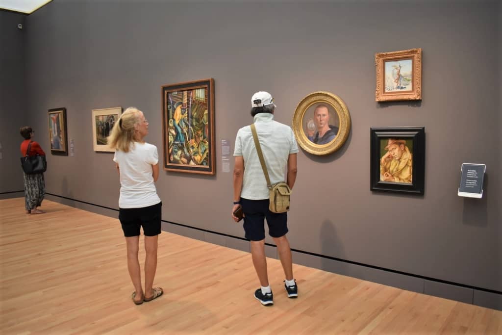 Visitors admire the various art pieces in one the the galleries inside Crystal Bridges. 