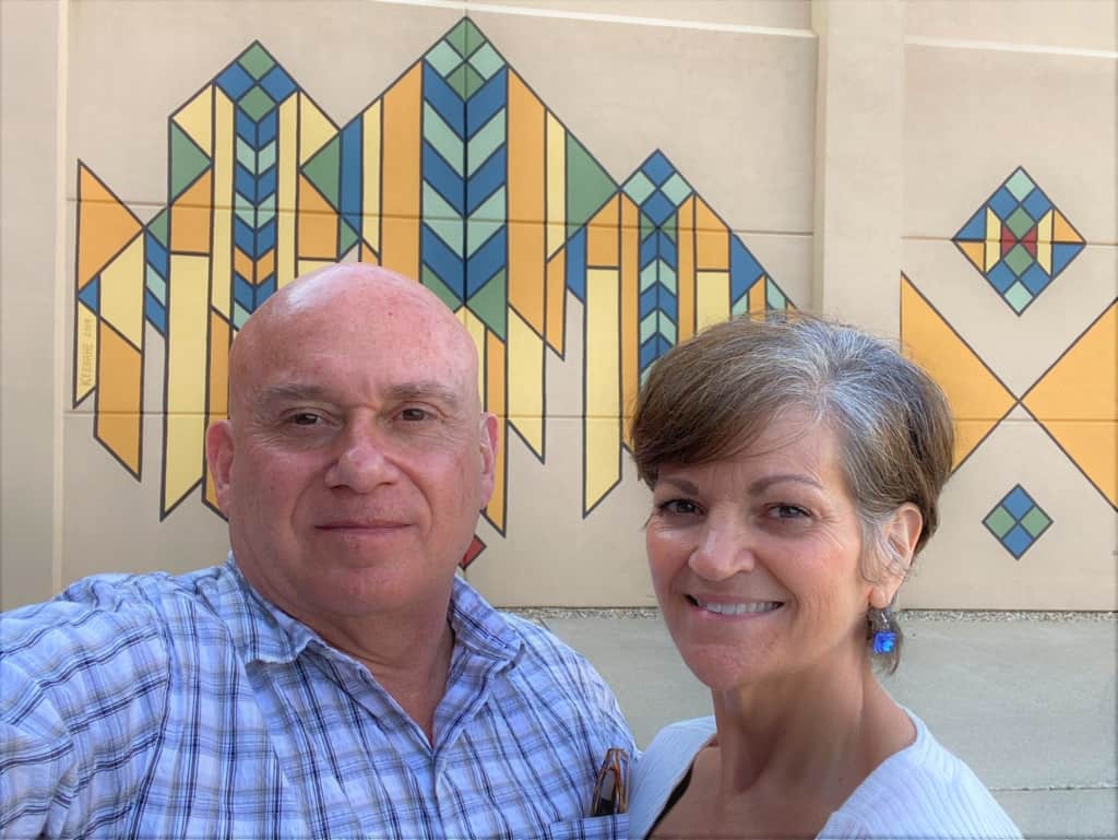 The authors pose for a selfie in front of one of the geometric murals found in Mason city, Iowa. 