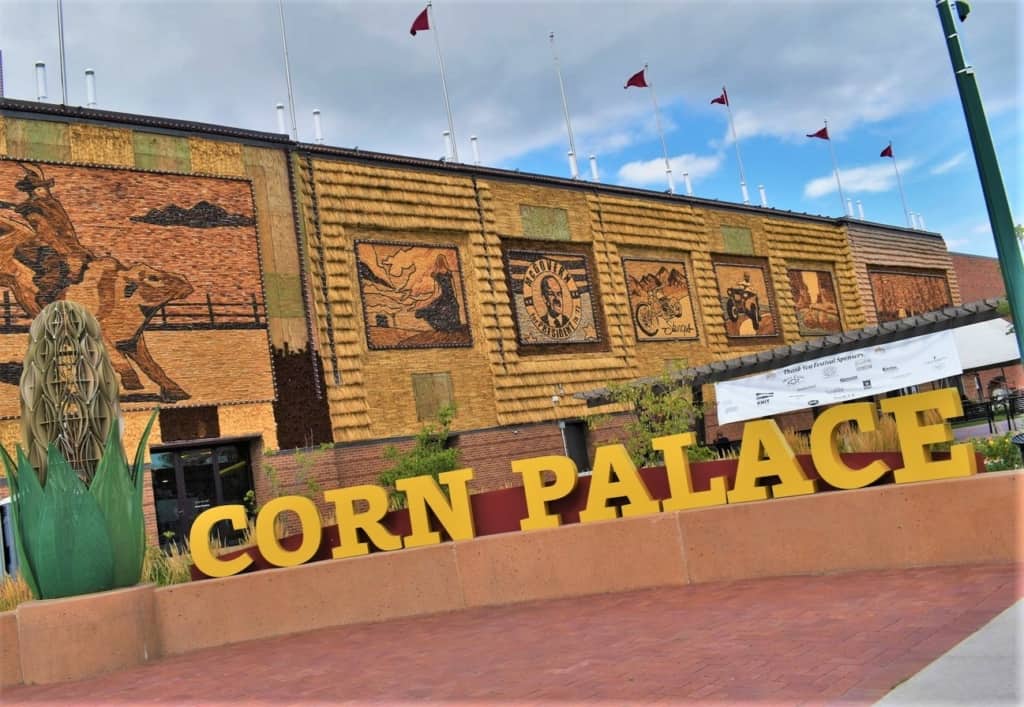 The exterior is bedecked with murals constructed with native grasses, corn, and grains. 
