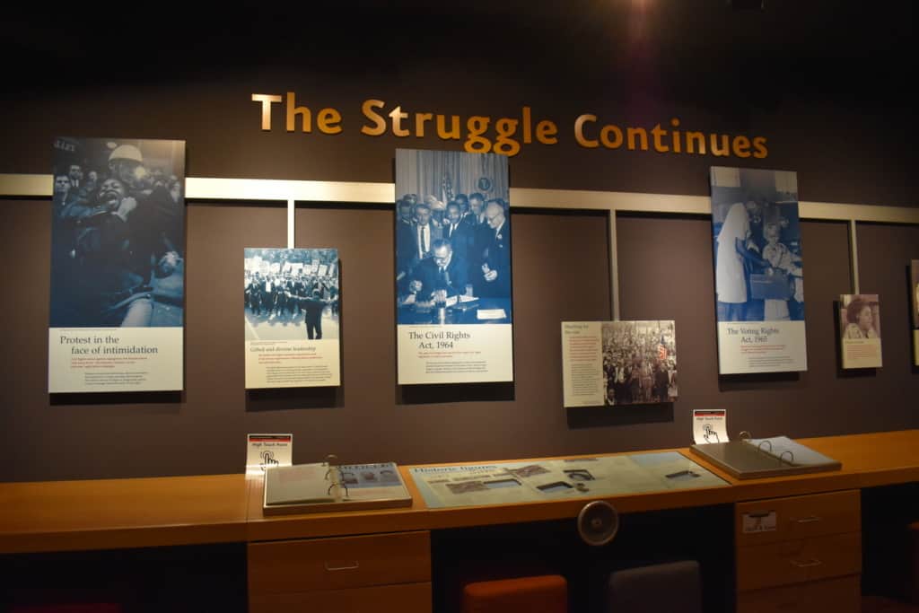 Exhibit pieces document how leveling the field required attacking segregation on multiple levels. 