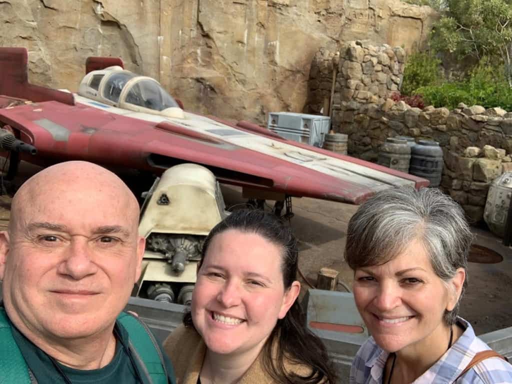 The authors pause for a selfie in front of some of the artifacts used to create an atmosphere of intergalactic entertainment. 