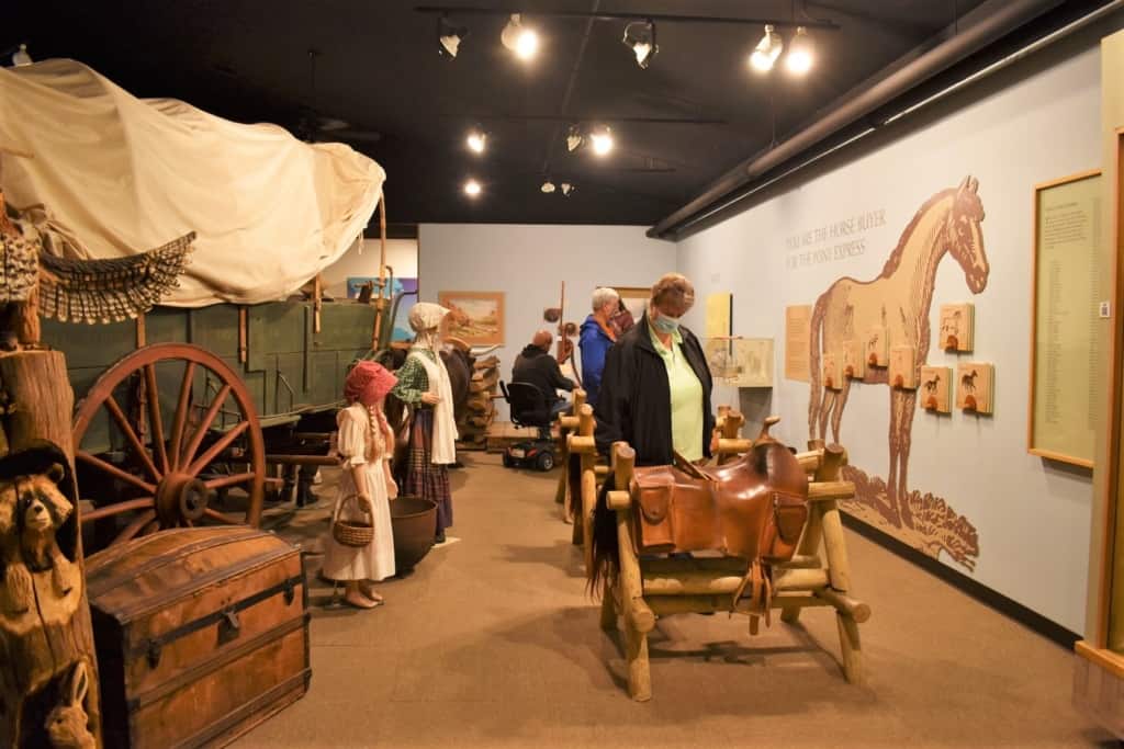 Visitors examine exhibits at the Pony Express Museum in St. Joseph, Missouri. 