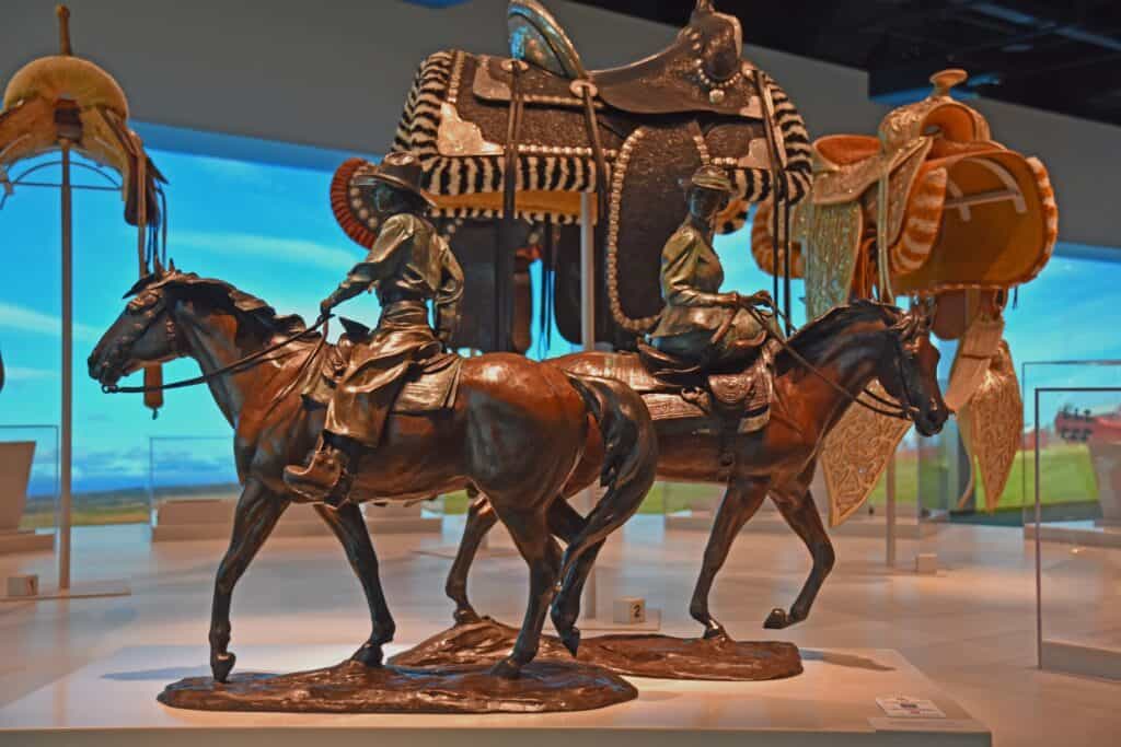 A statue of two styles of riding can be found at the National Cowgirl Museum.