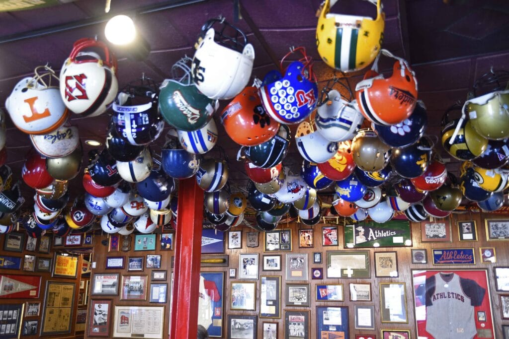 The celings are covered with football helmets and pennants.