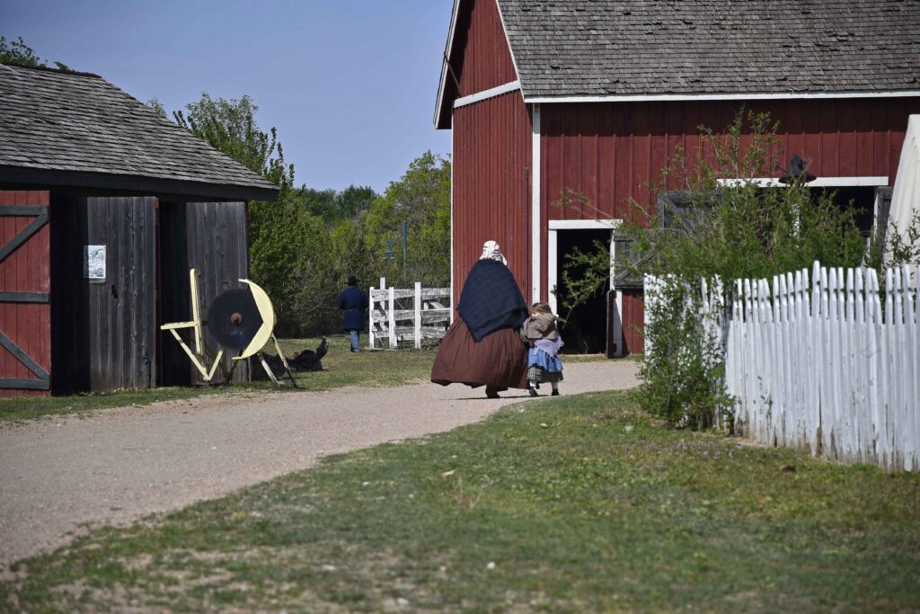 A mother and daughter scurry toward home at the end of the day in Old Cowtown.