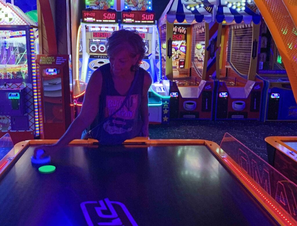 Crystal shows her fierce side during a game of air hockey.
