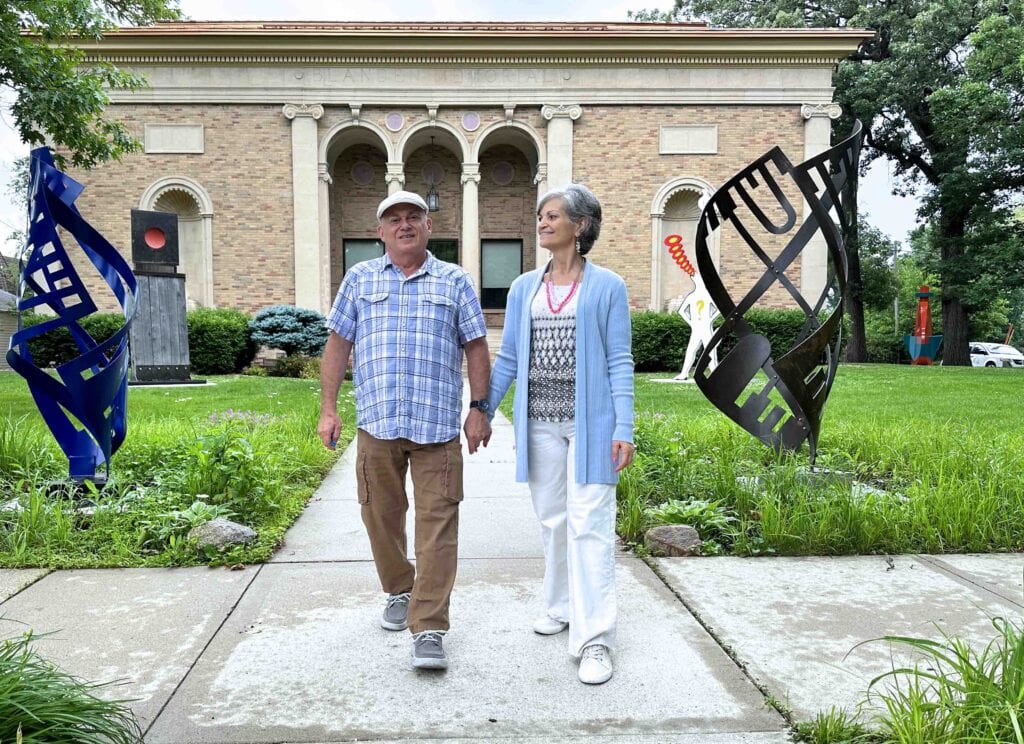 The authors pose for a selfie outside the Blanden Memorial Art Museum.