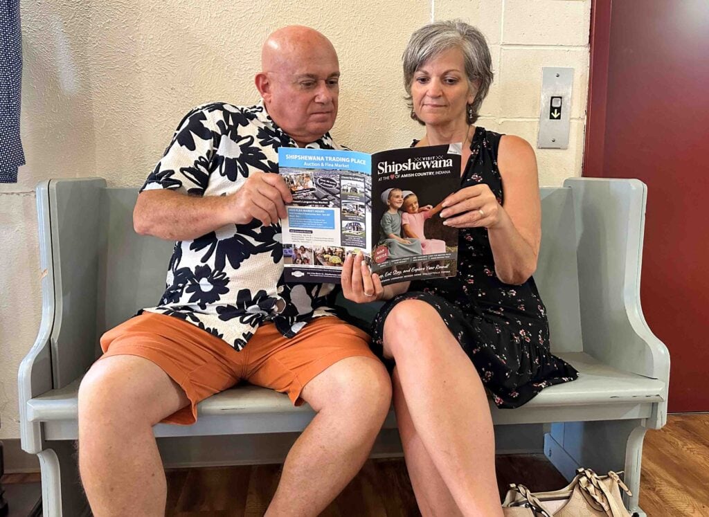 The authors look for things to do in Shipshewana by reviewing the local visitors guide.