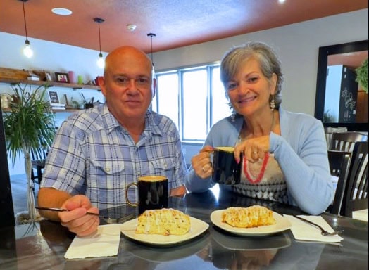The authors pause for lattes and scones during a visit to Ardys Mae Coffee in Fort Dodge, Iowa.