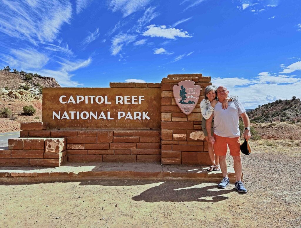 The authors pausing for a selfie at the entrance to Capitol Reef National Park.