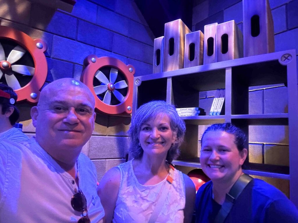 The authors pause during their visit to Epic Universe Mario and Dragons worlds.