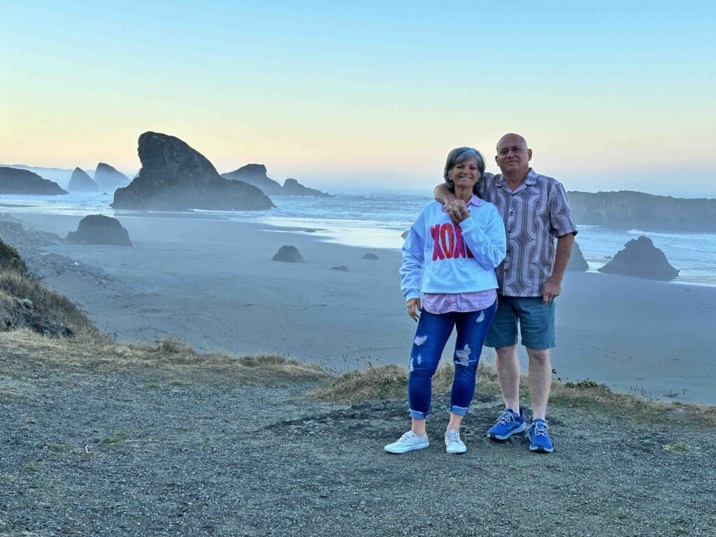 The authors pose at Shark Fin Rock during their Oregon Coast Road Trip.