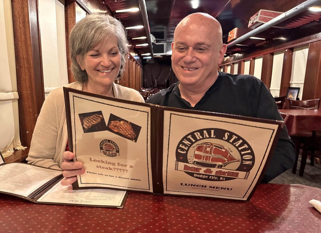 The authors pause to reflect on the menu at Central Station Bar & Grill in Dodge City, Kansas.