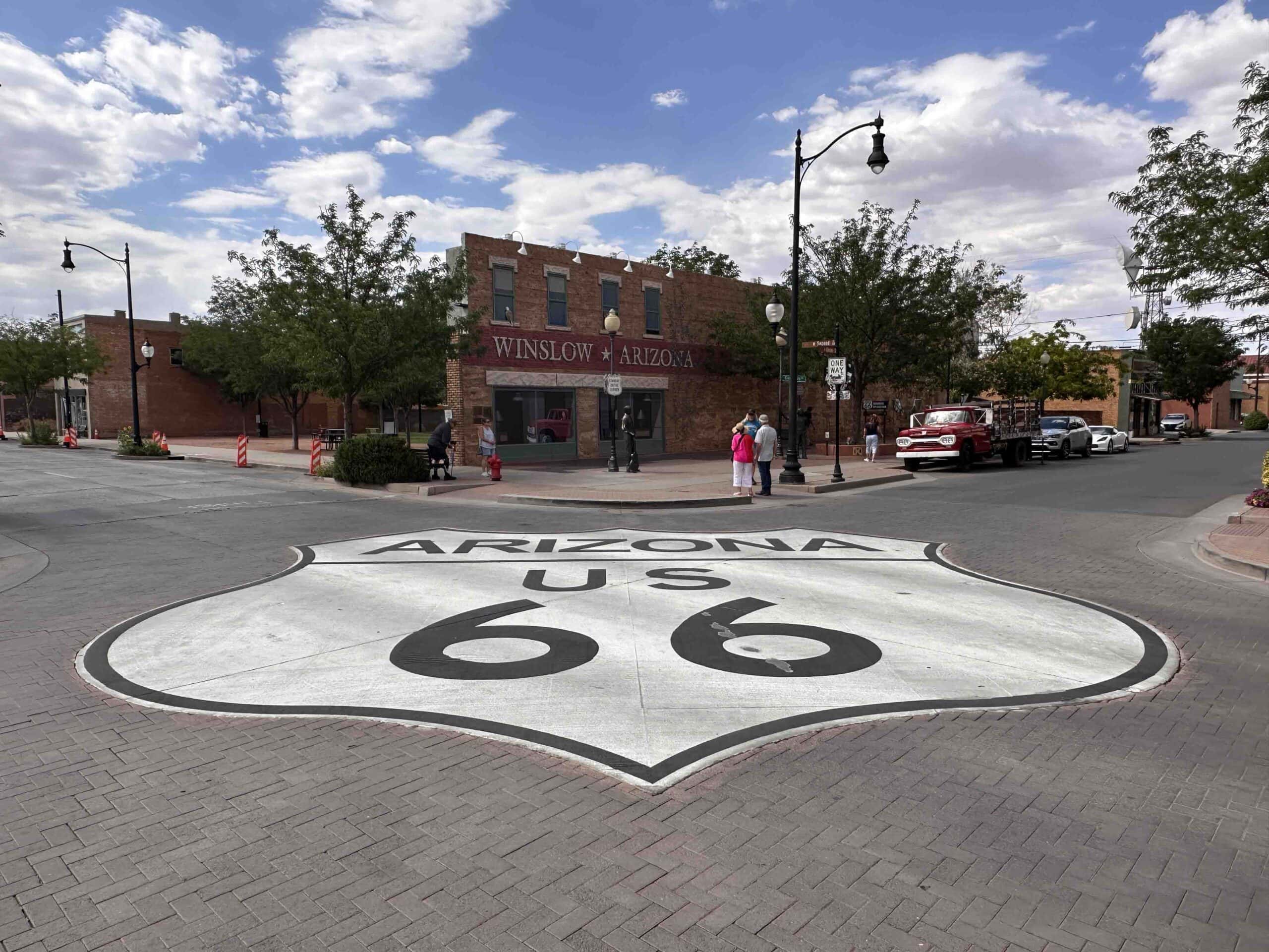The iconic Route 66 badge adorns the intersection at Standin' on the Corner Park.